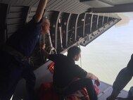 Rear Adm. Scott A. Buchman, and Florida Senator Marco Rubio survey damage caused by Hurricane Matthew along Florida’s coastline from the rear of a Coast Guard HC-144 Ocean Sentry airplane from Air Station Miami on Oct. 8, 2016. The over flight is part of the Coast Guard’s process of assessing damage in the wake of the storm. U.S. Coast Guard photo by Petty Officer 2nd Class Ashley J. Johnson