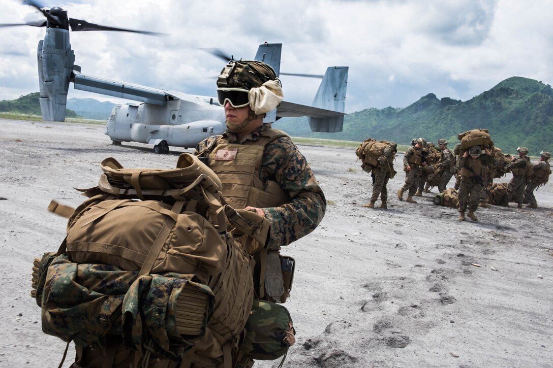 Marines with Echo Company, 2nd Battalion, 4th Marine Regiment, land in Colonel Ernesto Ravina Air Base, Philippines, to begin bilateral training with their counterparts in the Philippine Marine Corps as part of Philippine Amphibious Landing Exercise 33 (PHIBLEX). PHIBLEX is an annual U.S.-Philippine military bilateral exercise that combines amphibious capabilities and live-fire training with humanitarian civic assistance efforts to strengthen interoperability and working relationships.(U.S. Navy photo by Ensign Rob Kunzig/Released)