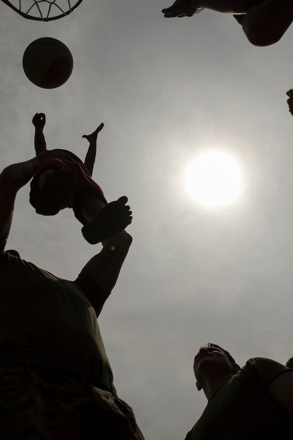 U.S. Marines with Echo Company, 2nd Battalion, 4th Marine Regiment, 31st Marine Expeditionary Unit, play basketball with students during a visit to Maruglo Elementary School on Col. Ernesto Ravina Air Base, Philippines, Oct. 6, 2016. Marines and Sailors with the 31st MEU visited the school to build unity between U.S. forces and the local residents during Philippine Amphibious Landing Exercise 33 (PHIBLEX). PHIBLEX is an annual U.S.-Philippine military bilateral exercise that combines amphibious capabilities and live-fire training with humanitarian civic assistance efforts to strengthen interoperability and working relationships. (U.S. Marine Corps Photo by Staff Sgt. T.T. Parish/Released) 