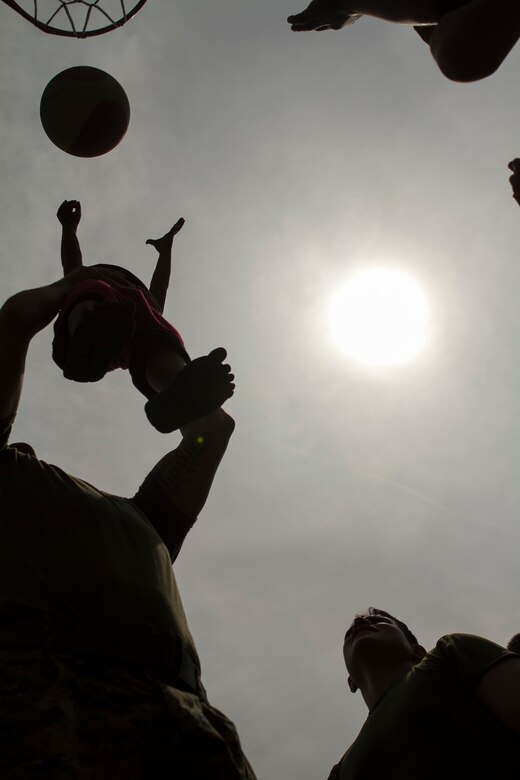 U.S. Marines with Echo Company, 2nd Battalion, 4th Marine Regiment, 31st Marine Expeditionary Unit, play basketball with students during a visit to Maruglo Elementary School on Col. Ernesto Ravina Air Base, Philippines, Oct. 6, 2016. Marines and Sailors with the 31st MEU visited the school to build unity between U.S. forces and the local residents during Philippine Amphibious Landing Exercise 33 (PHIBLEX). PHIBLEX is an annual U.S.-Philippine military bilateral exercise that combines amphibious capabilities and live-fire training with humanitarian civic assistance efforts to strengthen interoperability and working relationships. (U.S. Marine Corps Photo by Staff Sgt. T.T. Parish/Released) 
