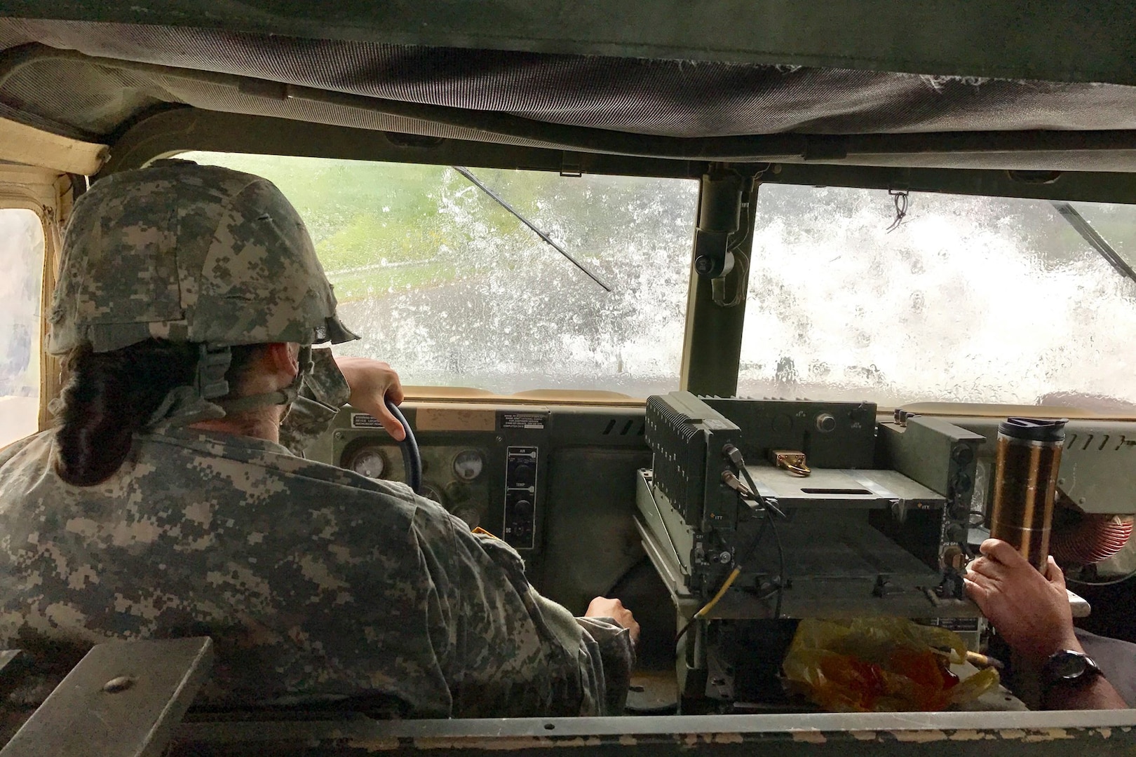 Soldiers from the Powhatan-based 180th Engineer Company, 276th Engineer Battalion transport a Hampton Police officer on a route assessment to identify road hazards caused by high water in the wake of Hurricane Matthew. Read more at http://go.usa.gov/xk8ng. 