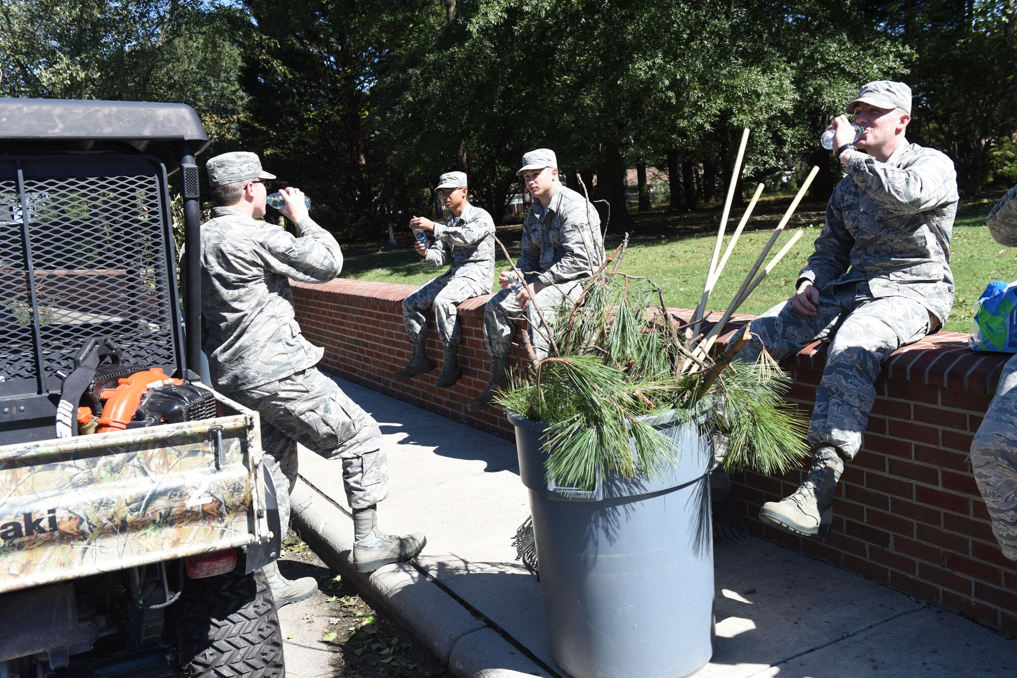Airmen assigned to the Pride Team Program take a break from picking up branches around the base from the aftermath of Hurricane Matthew, Oct. 9, 2016, at Seymour Johnson Air Force Base, North Carolina. Many areas around base and Goldsboro, North Carolina were flooded and have fallen trees and power outages as a result of the storm, but Team Seymour members continue to complete the mission. (U.S. Air Force photo by Airman 1st Class Ashley Williamson)