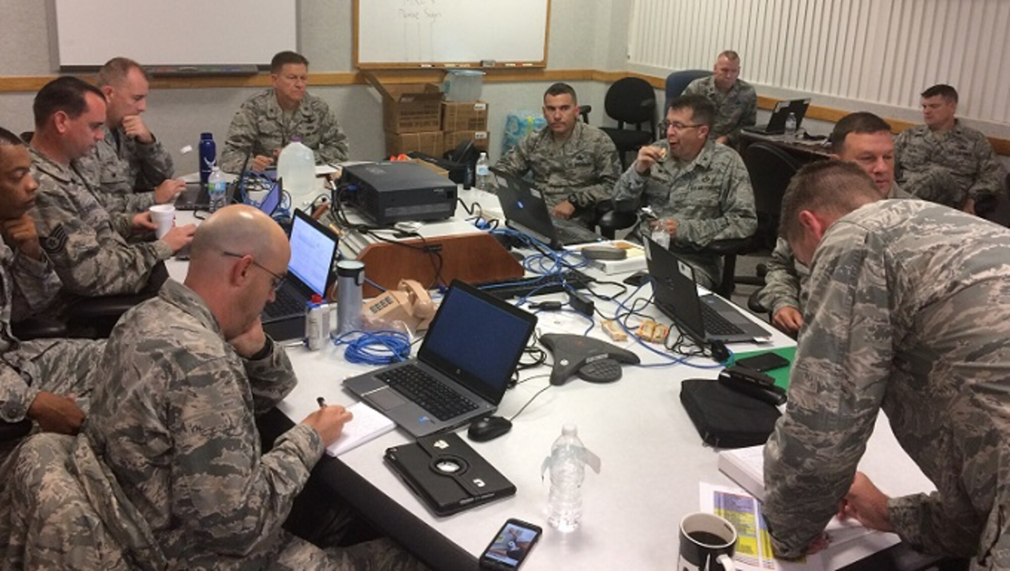 The "Silver Team" assumed command of the installation and released the "Blue Team" as mission control when they stood up at Kennedy Space Center Oct. 6, 2016. Two command and control teams and two hurricane recovery teams stood up during Hurricane Matthew to ride out the storm while Patrick Air Force Base and Cape Canaveral Air Force Station were closed. Together, the wing teams ran 24-hour operations and monitored the storm track from the day prior to the arrival of Hurricane Matthew through recovery operations. The 45th SW returned to normal operations within three days following the storm. (Courtesy photo)