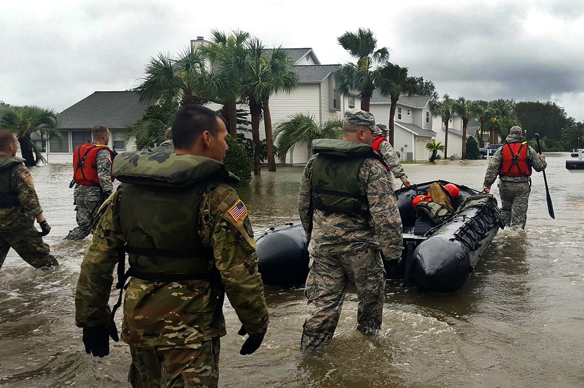 A search and rescue team with the Florida National Guard wades into areas in St. Augustine, Florida, affected by Hurricane Matthew to assist with disaster relief efforts. More than 9000 Guard members are on duty throughout Florida, Georgia and the Carolinas assisting state and local authorities with search and rescue and relief operations. (Photo courtesy Florida National Guard)