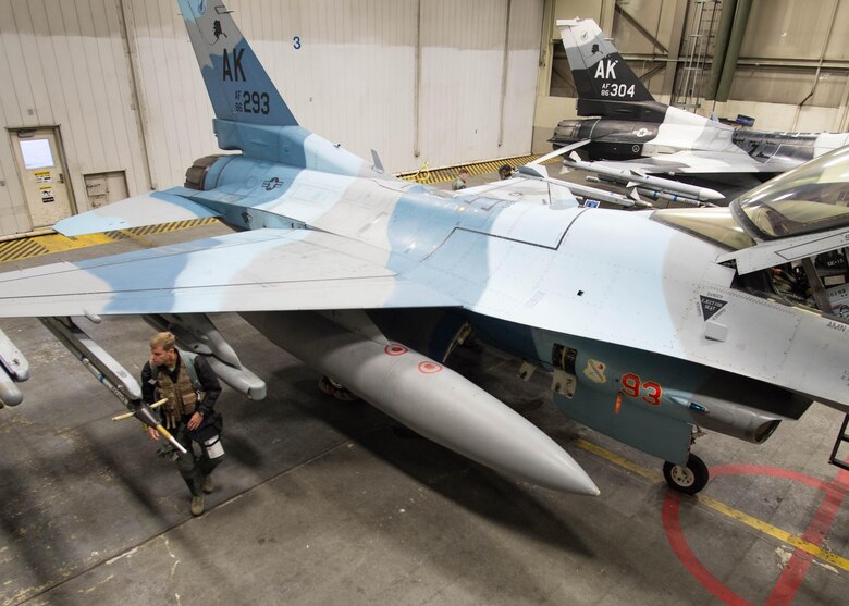 U.S. Air Force Col. David Mineau, the 354th Fighter Wing commander, conducts a last-minute check on an F-16 Fighting Falcon aircraft, in preparation for a mission Oct. 10, 2016, during RED FLAG-Alaska (RF-A) 17-1 at Eielson Air Force Base, Alaska. RF-A provides unique opportunities to integrate various forces into joint, coalition and multilateral training from simulated forward operating bases. (U.S. Air Force photo by Staff Sgt. Shawn Nickel)
