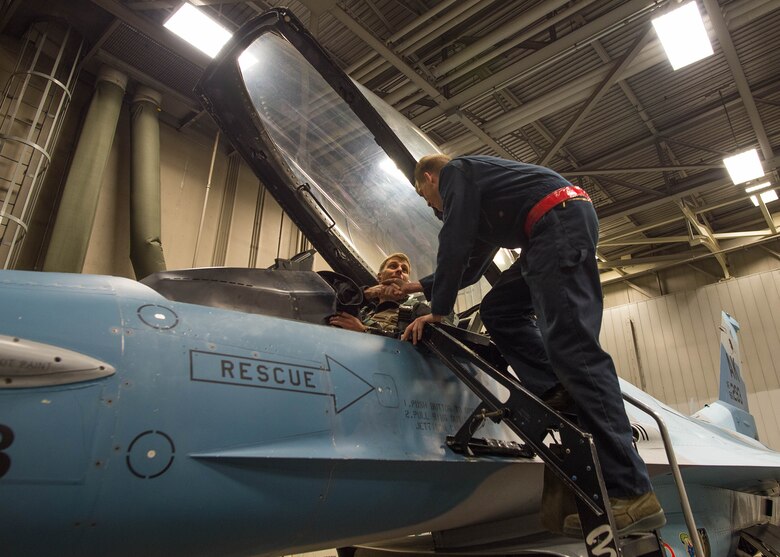 U.S. Air Force Airman 1st Class Spencer Hall, a 354th Aircraft Maintenance Squadron crew chief, bids farewell to Col. David Mineau, the 354th Fighter Wing commander, in an F-16 Fighting Falcon aircraft, prior to a sortie Oct. 10, 2016, during RED FLAG-Alaska (RF-A) 17-1 at Eielson Air Force Base, Alaska. RF-A enables joint and international units to sharpen their combat skills by flying simulated combat sorties in a realistic threat environment. (U.S. Air Force photo by Staff Sgt. Shawn Nickel)
