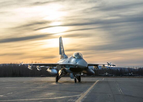 U.S. Air Force Col. David Mineau, the 354th Fighter Wing commander, prepares to take off in an F-16 Fighting Falcon aircraft after finishing end of runway checks Oct. 10, 2016, during RED FLAG-Alaska (RF-A) 17-1 at Eielson Air Force Base, Alaska. RF-A simulates the first 10 combat sorties of an initial surge during a conflict, enabling pilots to better understand the stresses of the environment. (U.S. Air Force photo by Staff Sgt. Shawn Nickel)
