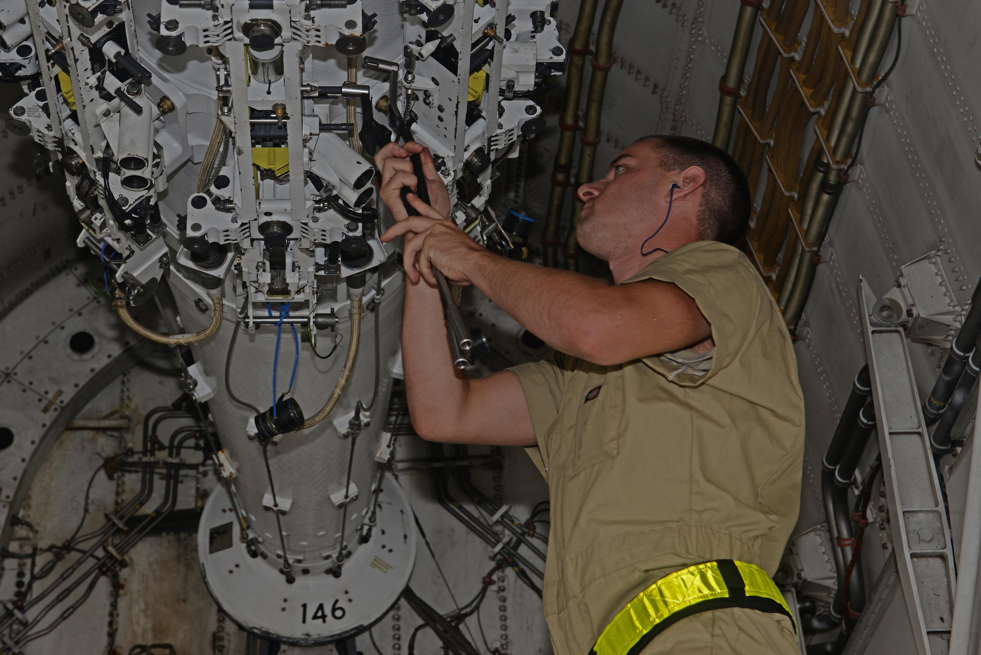 Senior Airman Daniel Sorters, 34th Expeditionary Aircraft Maintenance Unit load crew member, prepares to load a training AGM-158 Joint Air-to-Surface Standoff Missile in a B-1B Lancer during a loading exercise held Sept. 29, 2016, at Andersen Air Force Base, Guam. The Airmen loaded 12 training AGM-158 JASSMs into a B-1 as part of an exercise to test their ability to quickly and safely load the aircraft with munitions. (U.S. Air Force photo by Airman 1st Class Alexa Ann Henderson)