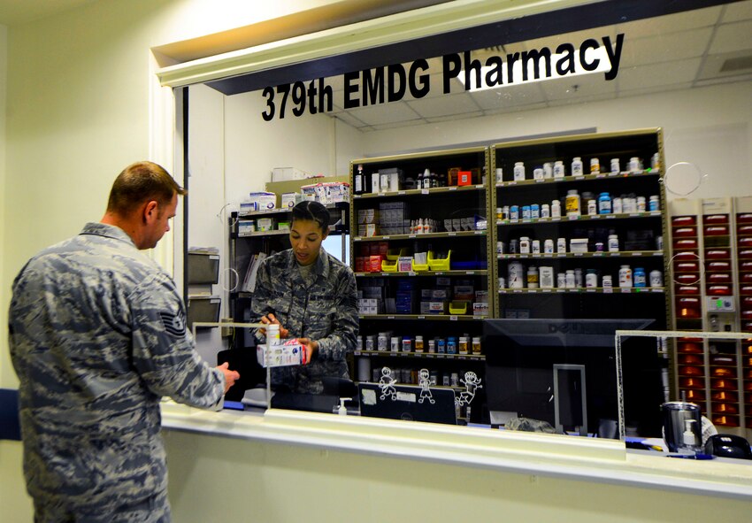 Staff Sgt. Marckia Wilson, 379th Expeditionary Medical Support Squadron pharmacy technician, hands a patient his prescribed medicine at the clinic Oct. 4, 2016, at Al Udeid Air Base, Qatar. The pharmacy provides 24/7 medication access to all active duty, guard and reservists as well as command sponsored family members over the age of 14. (U.S. Air Force photo/Senior Airman Janelle Patiño/Released)