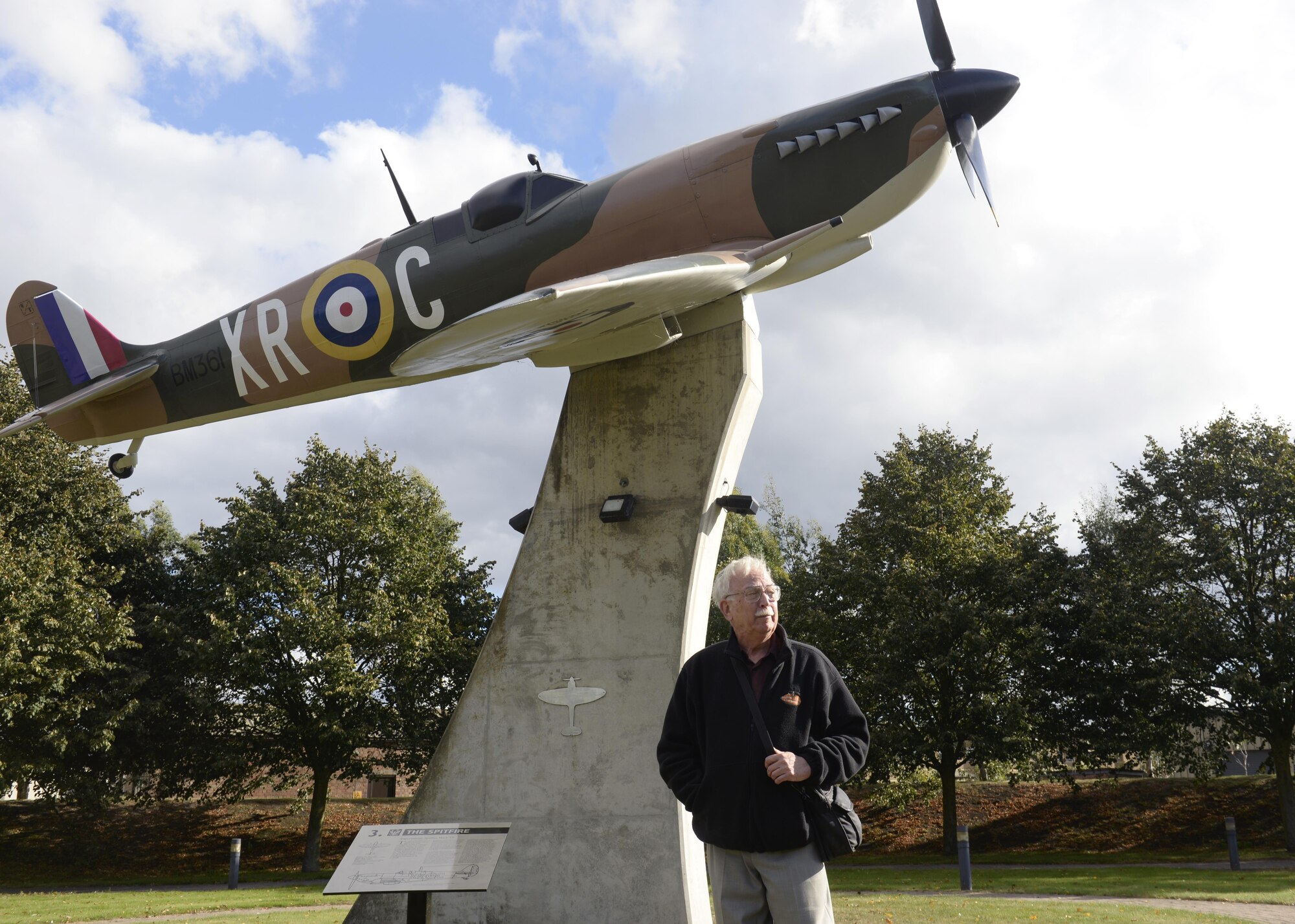 Michael Peterson, son of former base commander Maj. Gen. Chesley G. Peterson, stands in front of a replica of his father’s Supermarine Spitfire at Royal Air Force Lakenheath, England, Oct. 5. Michael brought an old friend who knew his father to see the replica and other memorabilia at the Liberty Wing. (U.S. Air Force photo/Airman 1st Class Abby L. Finkel) 