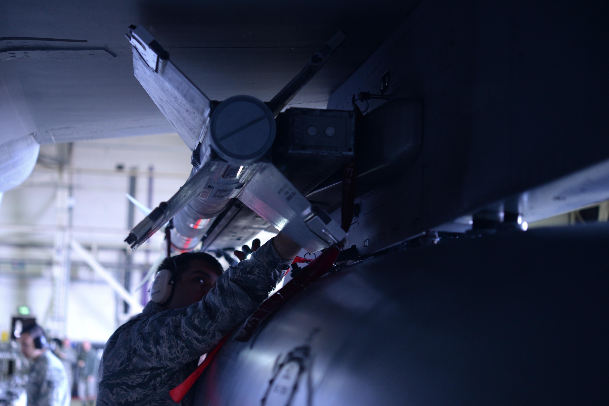 U.S. Air Force Tech. Sgt. Jason Trehearne, 493rd Aircraft Maintenance Unit weapons load crew team chief, loads a missile onto an F-15C Eagle at Royal Air Force Lakenheath, England, Oct. 6. The missile was loaded as part of a quarterly load crew competition. The 48th Maintenance Group holds the competitions to give Airmen a chance to show off their technical prowess to peers and wing leadership. 