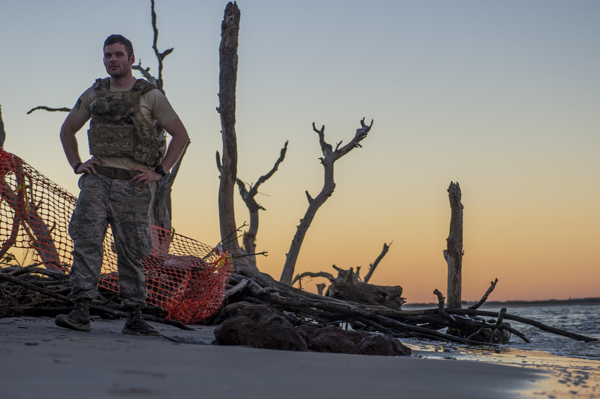 U.S. Air Force Senior Airman Michael Schuffer, an Explosive Ordnance Disposal technician with the 628th Civil Engineer squadron, work with local law enforcement bomb squad members to transport Civil War cannonballs washed ashore from  Hurricane Matthew to a safe location at Folly Beach, S.C., Oct. 9, 2016. After the discovery of ordnance on the beach, local law enforcement and Air Force personnel worked together to properly dispose of the hazards. 