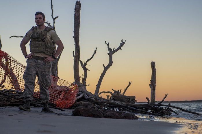 U.S. Air Force Senior Airman Michael Schuffer, an Explosive Ordnance Disposal technician with the 628th Civil Engineer squadron, work with local law enforcement bomb squad members to transport Civil War cannonballs washed ashore from  Hurricane Matthew to a safe location at Folly Beach, S.C., Oct. 9, 2016. After the discovery of ordnance on the beach, local law enforcement and Air Force personnel worked together to properly dispose of the hazards. 