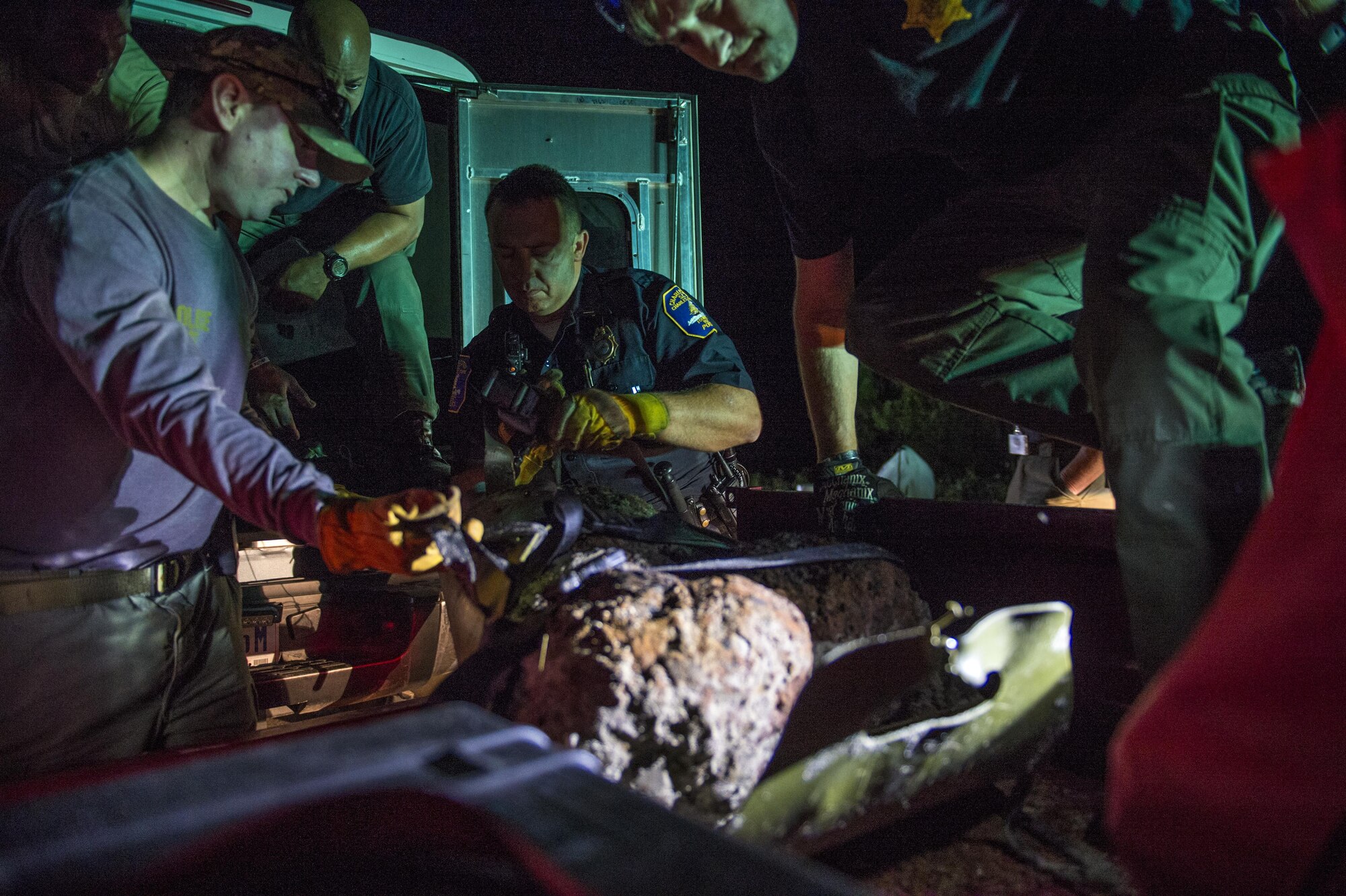 U.S. Air Force Explosive Ordnance Disposal technicians work with local law enforcement bomb squad members to transport Civil War cannonballs washed ashore from  Hurricane Matthew to a safe location at Folly Beach, S.C., Oct. 9, 2016. After the discovery of ordnance on the beach, local law enforcement and Air Force personnel worked together to properly dispose of the hazards.  