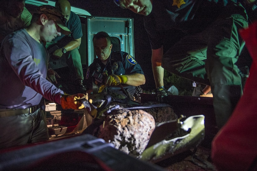 U.S. Air Force Explosive Ordnance Disposal technicians work with local law enforcement bomb squad members to transport Civil War cannonballs washed ashore from  Hurricane Matthew to a safe location at Folly Beach, S.C., Oct. 9, 2016. After the discovery of ordnance on the beach, local law enforcement and Air Force personnel worked together to properly dispose of the hazards.  