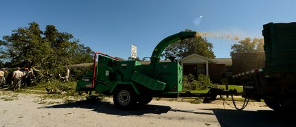 U.S. Air Force civil engineers with the 628th Civil Engineer Squadron remove fallen trees on Hunley Park-Air Base housing done by Hurricane Matthew on Joint Base Charleston, S.C., Oct. 9, 2016. All non-essential personnel evacuated the area, but returned after disaster response coordinators assessed damage and verified a safe operating environment. 