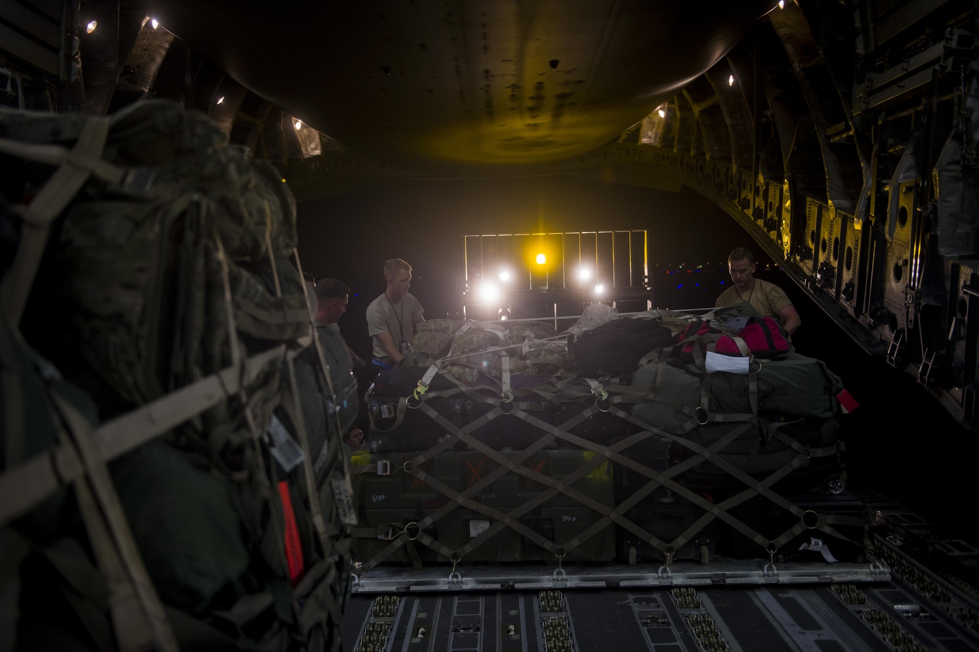 U.S. Air Force C-17 Globemaster III crewmembers load cargo during a transport mission in support of Operation Freedom Sentinel in Southwest Asia Sept. 30, 2016. The C-17 is the newest most flexible cargo aircraft to enter the airlift force. The C-17 is capable of rapid strategic delivery of troops and all types of cargo to main operating bases or directly to forward bases in the deployment area. (U.S. Air Force photo by Staff Sgt. Douglas Ellis/Released)