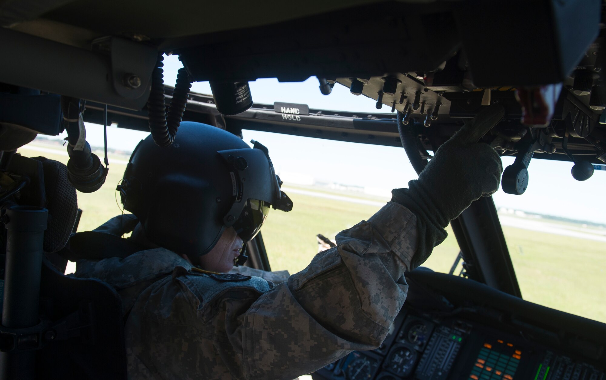 U.S. Army Chief Warrant Officer 4 Sean Reynolds, a pilot assigned to 2nd Battalion, 151st Brigade, South Carolina National Guard, prepares to fly a UH-60 Blackhawk over Joint Base Charleston, S.C., for an aerial damage assessment after Hurricane Matthew swept the area Oct. 9, 2016. All non-essential personnel evacuated the area, but returned after disaster response coordinators assessed damage and verified a safe operating environment. 