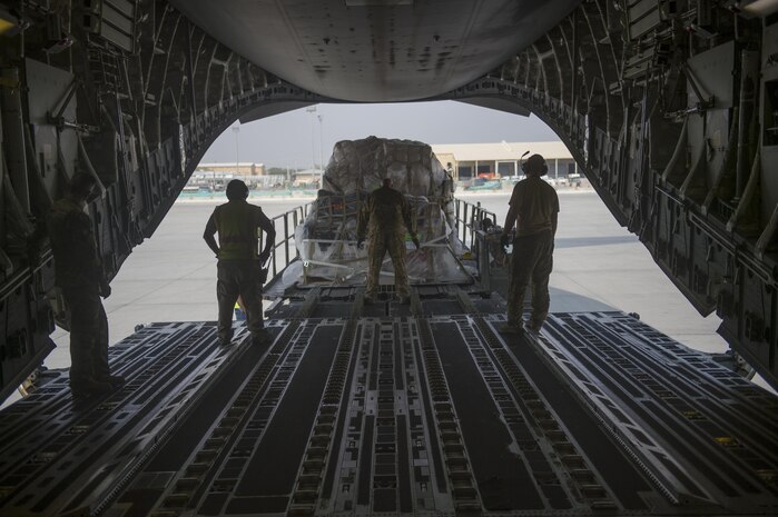 A U.S. Air Force C-17 Globemaster III loadmaster directs a loading truck during a transport mission in support of Operation Freedom Sentinel in Southwest Asia Sept. 30, 2016. The C-17 is the newest most flexible cargo aircraft to enter the airlift force. The C-17 is capable of rapid strategic delivery of troops and all types of cargo to main operating bases or directly to forward bases in the deployment area. (U.S. Air Force photo by Staff Sgt. Douglas Ellis/Released)