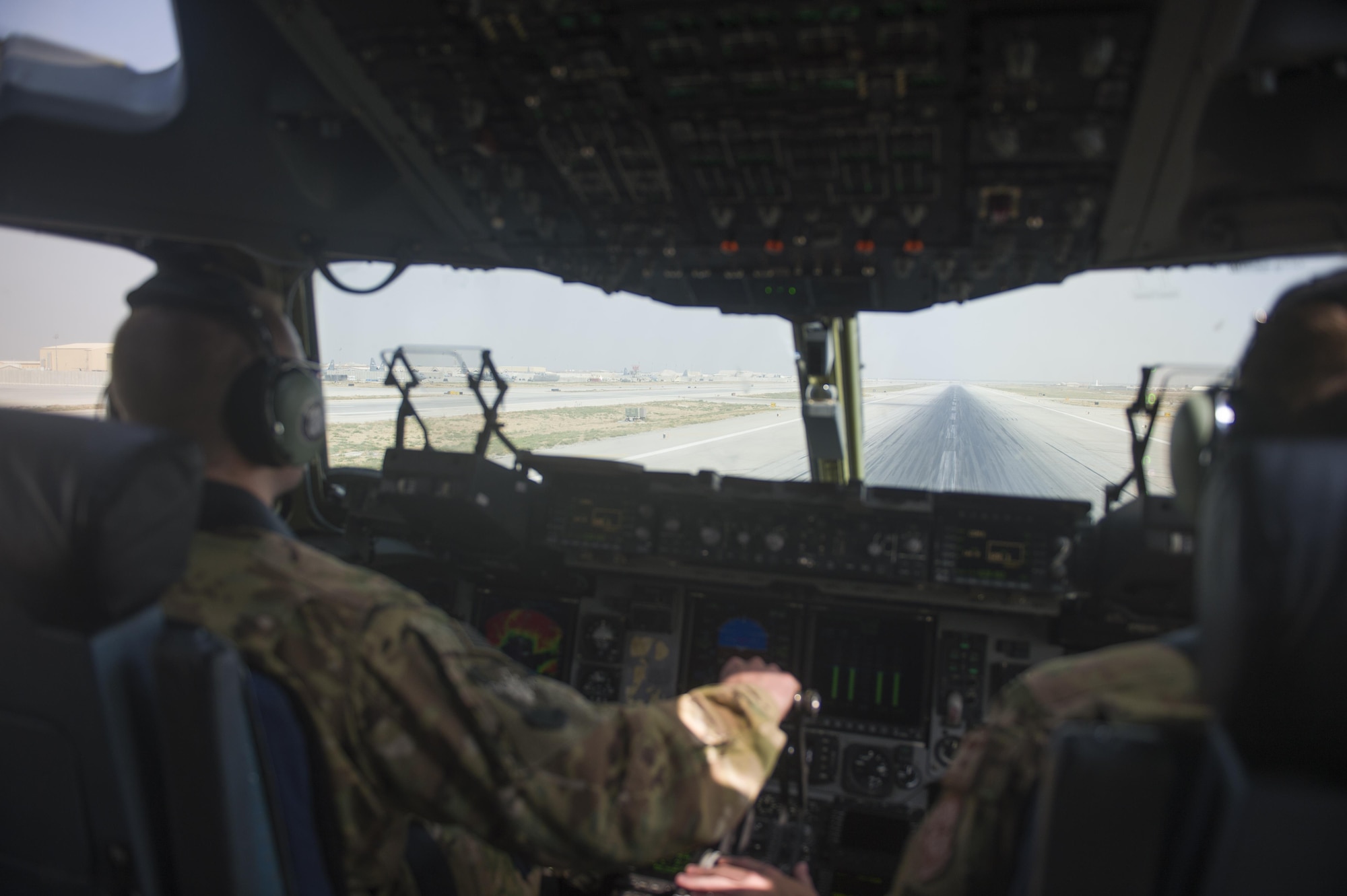 U.S. Air Force C-17 Globemaster III pilots prepare to take off during a transport mission in support of Operation Freedom Sentinel in Southwest Asia Sept. 30, 2016. The C-17 is the newest most flexible cargo aircraft to enter the airlift force. The C-17 is capable of rapid strategic delivery of troops and all types of cargo to main operating bases or directly to forward bases in the deployment area. (U.S. Air Force photo by Staff Sgt. Douglas Ellis/Released)