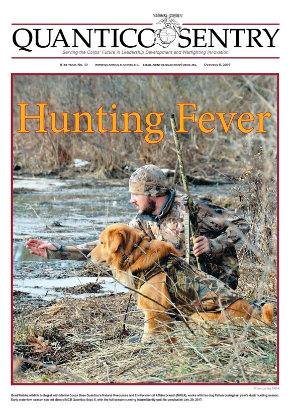 Brad Watkin, wildlife biologist with Marine Corps Base Quantico's Natural Resources and Environmental Affairs branch (NREA), works with his dog Patton during last year's duck hunting season. Early waterfowl season started aboard MCB Quantico Sept. 6, with the full season running intermittently until its conclusion Jan. 29, 2017.