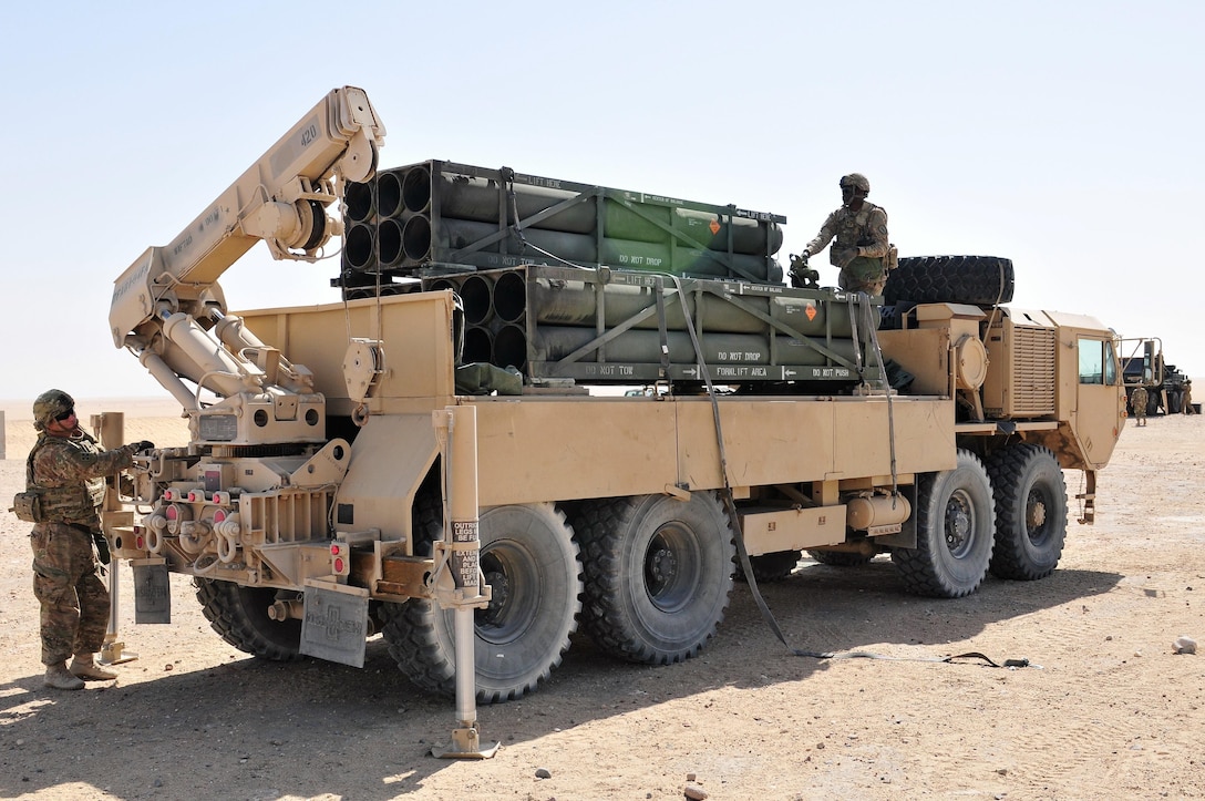 Soldiers of Alpha Company, 1st Battalion, 94th Field Artillery Regiment, load empty rocket packs from a M142 high mobility rocket system during a decisive action training environment exercise on Oct. 4, 2016 near Camp Buehring, Kuwait. The unit certified four HIMARS operator crews as well as a contingent of forward observers during the exercise (U.S. Army photo by Sgt. Aaron Ellerman)