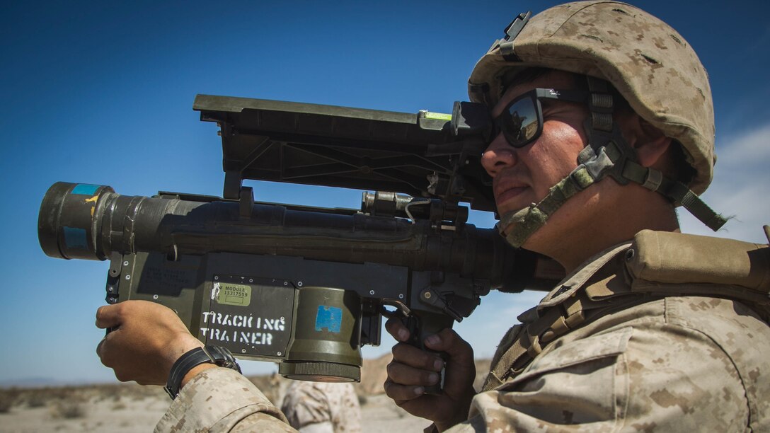 Lance Cpl. Pierre Ponce, low altitude air defense (LAAD) gunner with 2nd LAAD, Battery B, demonstrates the use of a FIM-92 Stinger during a ground based air defense exercise at Site 50, near Wellton, Ariz., Oct. 6, 2016. Weapons and Tactics Instructor course 1-17 is a seven week training event hosted by Marine Aviation Weapons and Tactics Squadron One (MAWTS-1) cadre which emphasizes operational integration of the six functions of Marine Corps aviation in support of a Marine Air Ground Task Force. MAWTS-1 provides standardized advanced tactical training and certification of unit instructor qualifications to support Marine aviation Training and Readiness and assists in developing and employing aviation weapons and tactics.