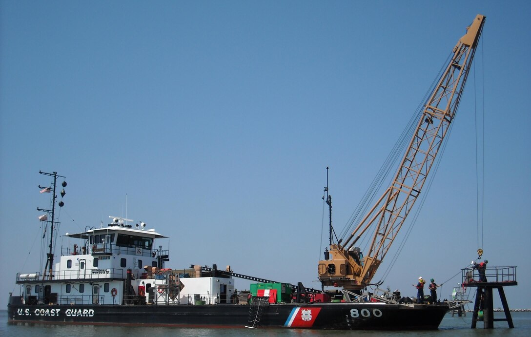 The U.S. Coast Guard Cutter Pamlico and crew repair the center entrance range of the Mississippi River at Southwest Pass. Pamlico, a 160-foot inland construction tender, homeported in New Orleans, is manned by 16 crewmembers, who construct fixed aids to navigation from Baton Rouge to the Southwest Pass of the Mississippi River and its surrounding waterways. (U.S. Coast Guard photo by Chief Warrant Officer H. V. Caskey)