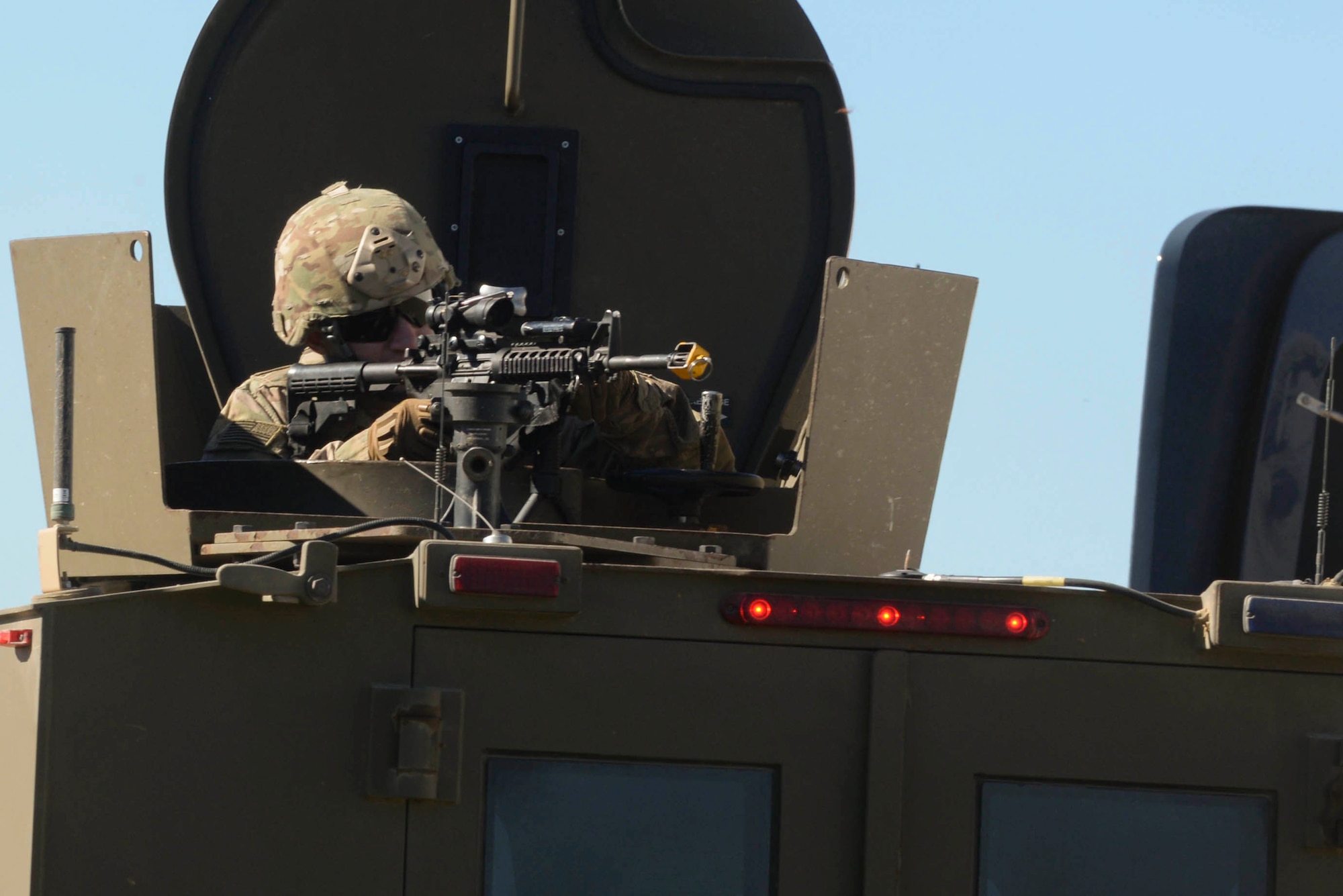 Airman 1st Class Joshua Hoskins, 791st Missile Security Forces Squadron response force member, scans his area of responsibility during training at Minot Air Force Base, N.D., Sept. 28, 2016. Response force members are trained in small unit tactics and guarding and recapturing resources and associated facilities from potential adversaries. (U.S. Air Force photo/Airman 1st Class Jessica Weissman)