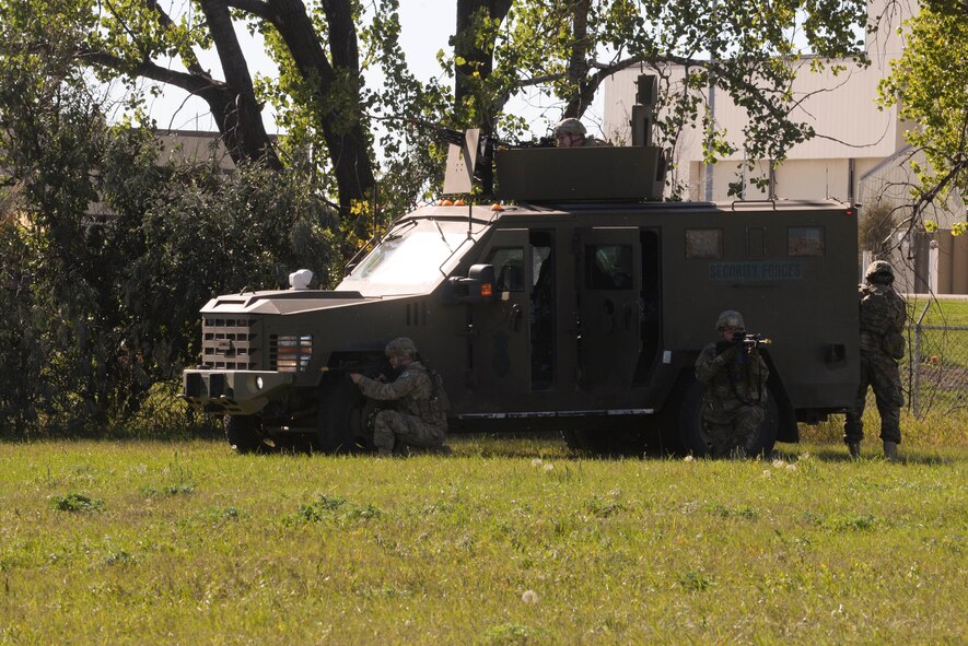 Members of the 791st Missile Security Forces Squadron set up 360-degree coverage around their vehicle during training at Minot Air Force Base, N.D., Sept. 28, 2016. The recapture and recovery training was designed to prepare missile response force and TRF members on how to conduct convoy response during a launch facility recapture. (U.S. Air Force photo/Airman 1st Class Jessica Weissman)