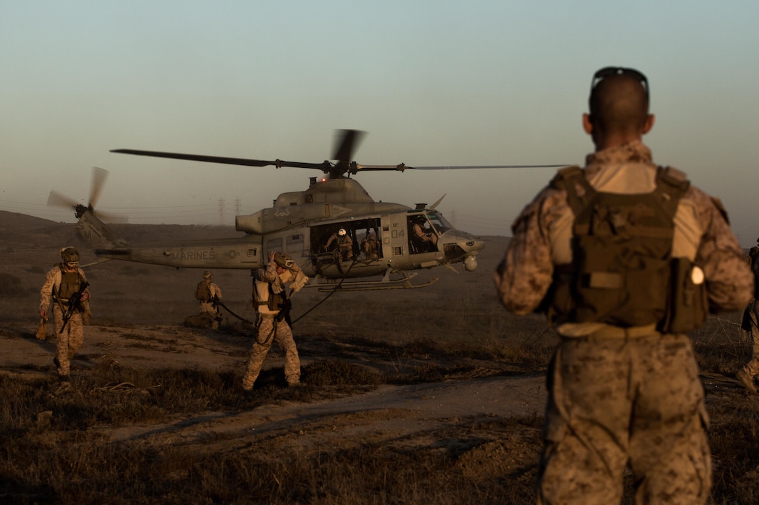 A UH-1Y Huey with Marine Light Attack Helicopter Squadron (HMLA) 369 prepares to land after Marines with 1st Reconnaissance Battalion, 1st Marine Division, finished a fast-rope drill aboard Marine Corps Base Camp Pendleton, Calif., Oct. 6. The fast-rope training was part of a larger event called a Marine Air-Ground Task Force integration exercise, which enabled air and ground units to come together and cooperate in various training missions prior to their deployment with the 15th Marine Expeditionary Unit. (U.S. Marine Corps photo by Sgt. Lillian Stephens/Released)