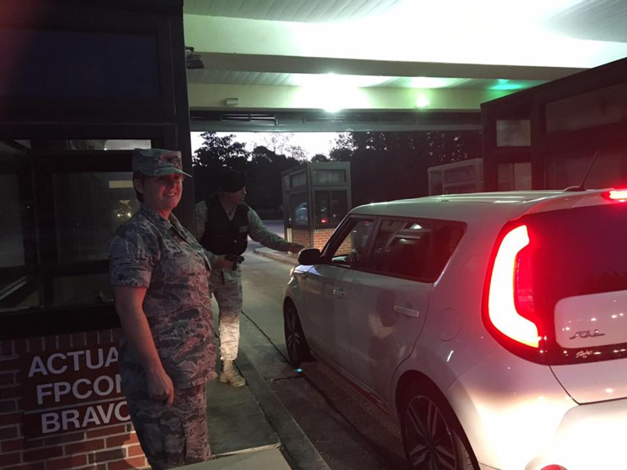 Col. Cherie Roff, 315th Mission Support Group commander, greats people as they return to work Oct. 11 after Hurricane Matthew evacuated the base last week.