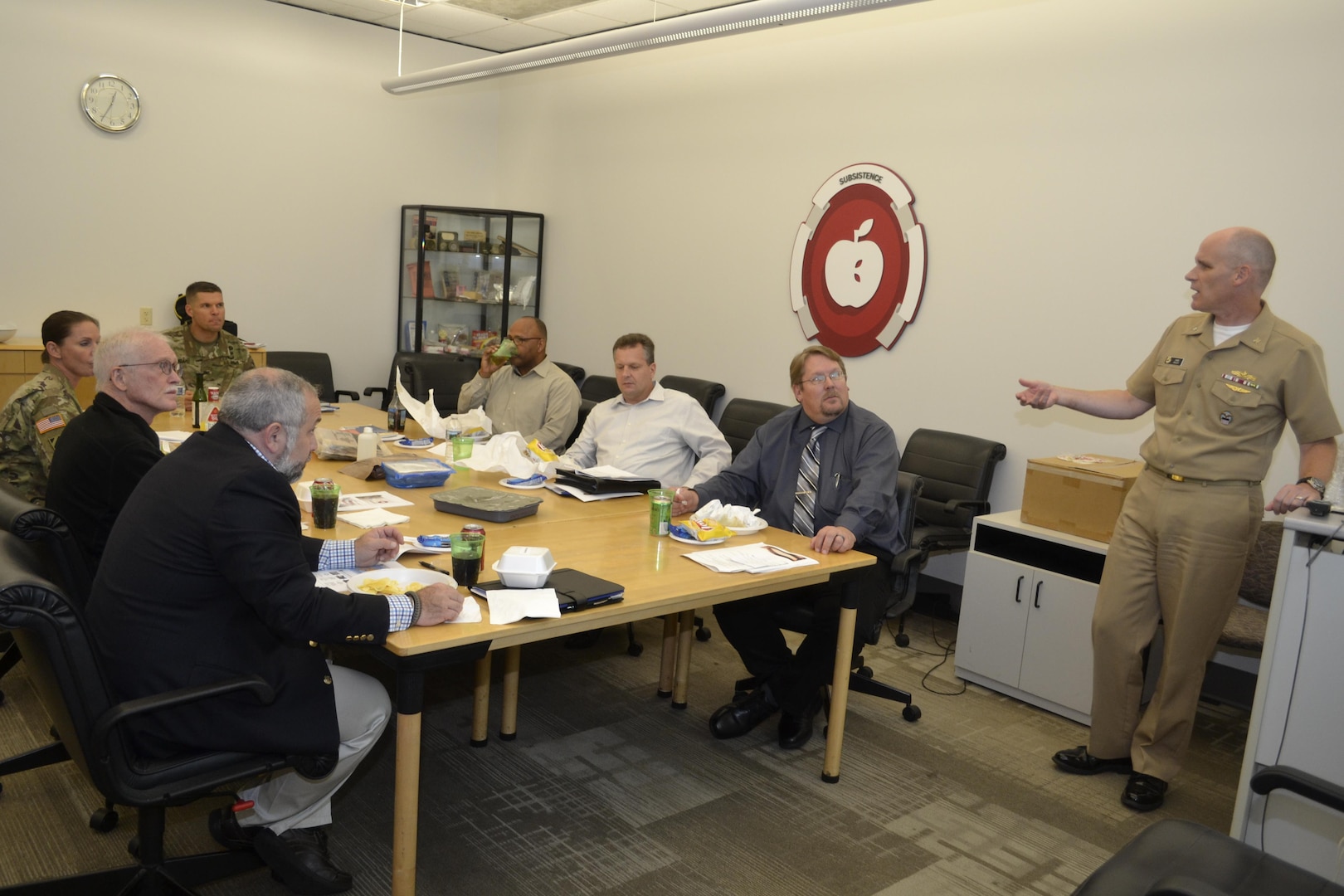 DLA Distribution Susquehanna, Pa., commander Army Col. Brad Eungard, head of table, receives an overview on DLA Troop Support’s Subsistence supply chain from Navy Cmdr. Christopher Zegley, Subsistence Customer Operations Readiness Division, far right, during a working lunch.  