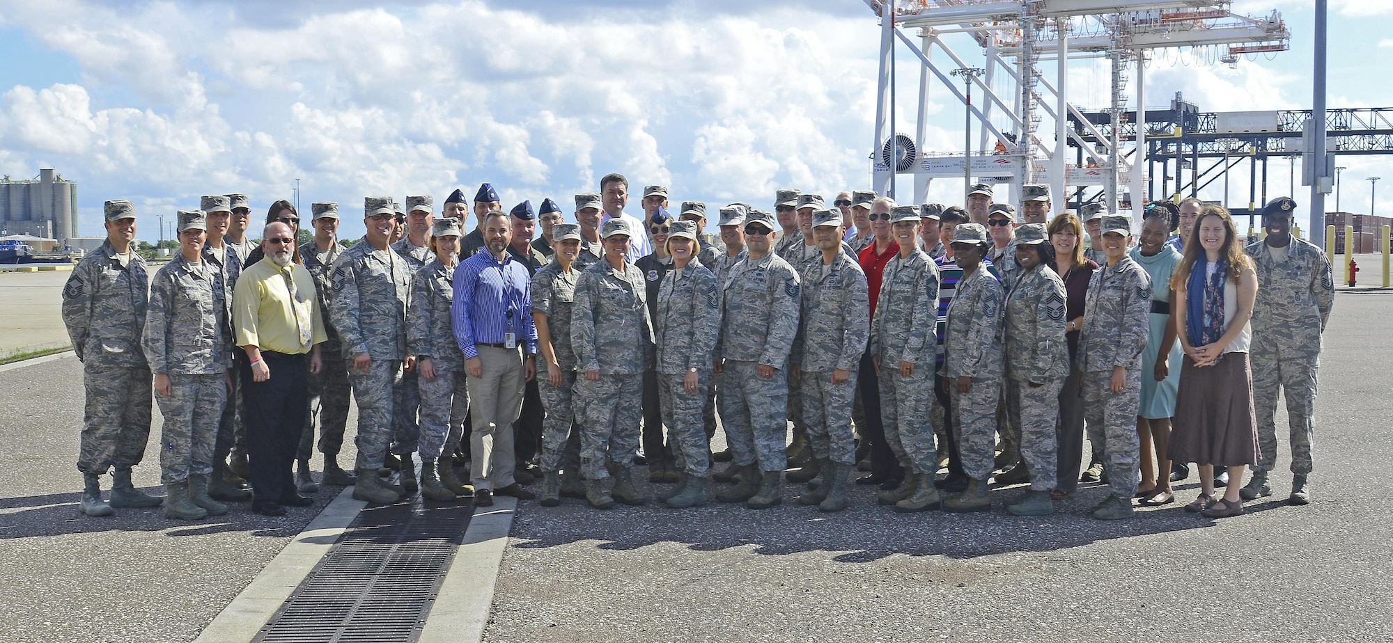 Members of Team MacDill and Tampa Port Authority pause for a group photo during an industry immersion tour in Tampa, Fla., Sept. 29, 2016. The purpose of the industry visit was to expose the group to an operation that uses continuous process improvement methods as an integral aspect of business. (U.S. Air Force photo by Staff Sgt. Melanie Hutto) 
