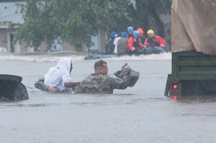 North Carolina Army National Guard members and local emergency services assist with evacuation efforts in Fayetteville, N.C., Oct. 08, 2016. Heavy rains caused by Hurricane Matthew have led to flooding as high as five feet in some areas.