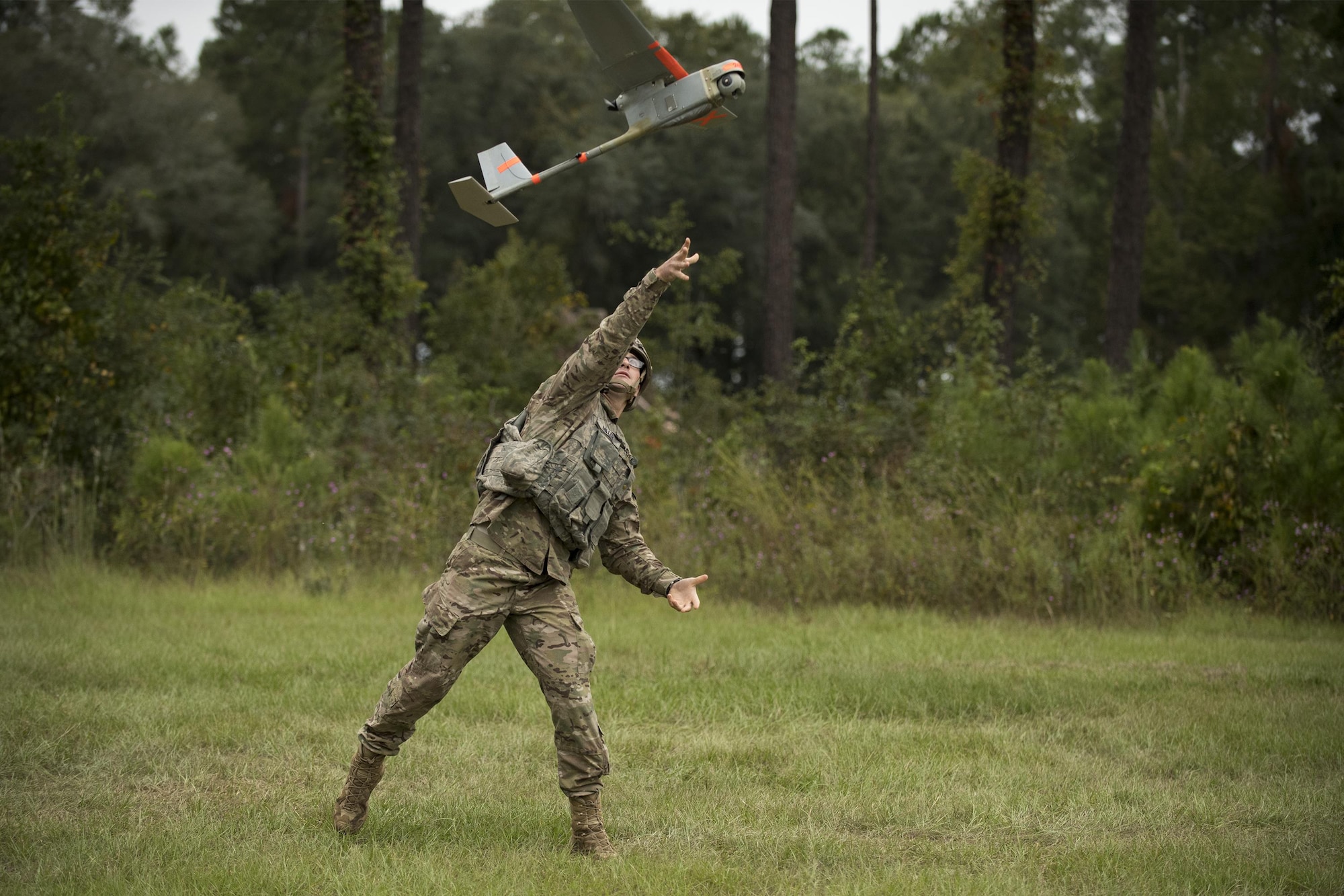 A U.S. Air Force Airman from the 820th Base Defense Group launches an RQ-11 Raven into flight, Oct. 6, 2016, at Moody Air Force Base, Ga. The RQ-11 is a remote-controlled aerial vehicle that provides real-time situational awareness while flying at speeds of 30 to 60 mph. (U.S. Air Force photo by Airman 1st Class Daniel Snider)