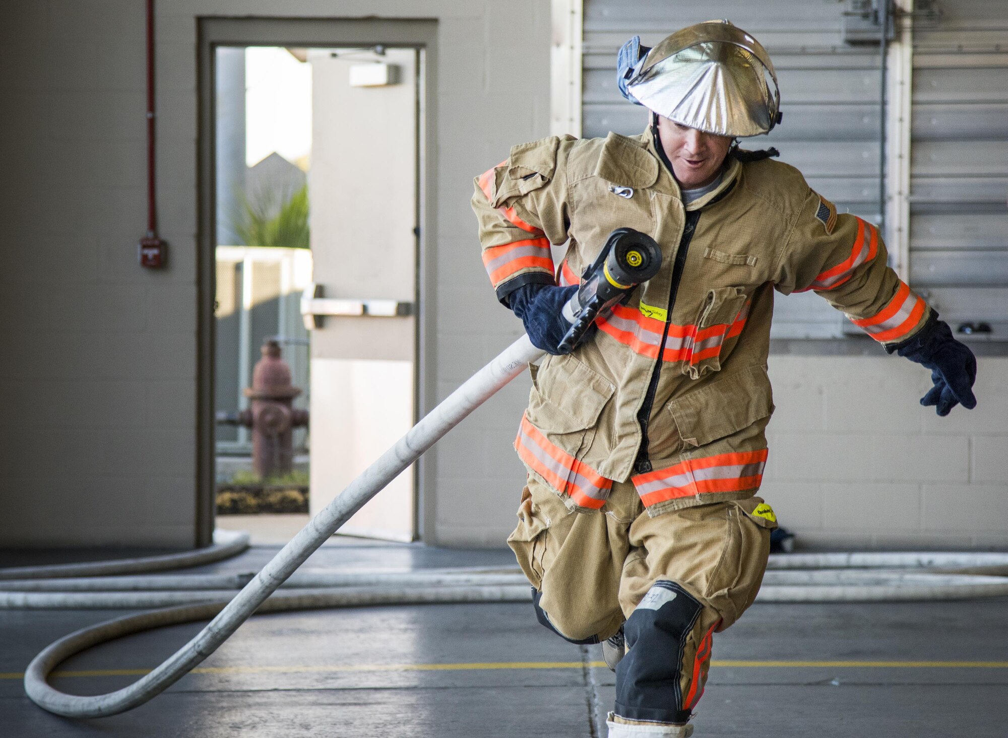 An Airman begins the firefighter fitness competition Oct. 11 at Eglin Air Force Base, Fla.  The competition pitted base enlisted and officer leadership in a duel for the best time to complete six firefighter fitness events.  The Eagles claimed victory over the Chiefs and first sergeants took the win over the squadron commanders.  (U.S. Air Force photo/Samuel King Jr.)