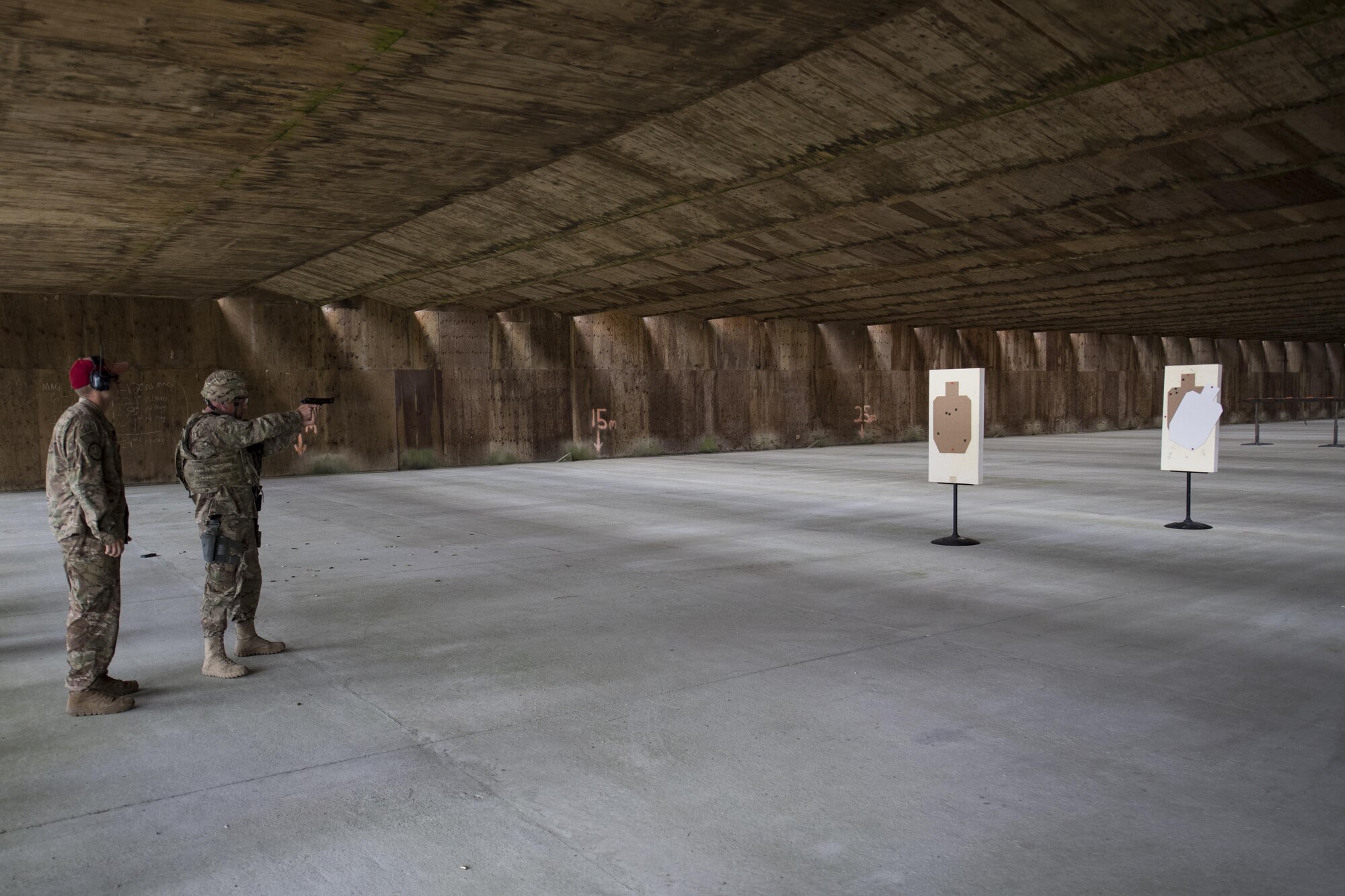 U.S. Air Force Chief Master Sgt. Frank H. Batten III, 9th Air Force command chief, fires an M9 pistol into a target, Oct. 6, 2016, at Moody Air Force Base, Ga. Batten and Maj. Gen. Scott Zobrist, 9th Air Force commander, were teamed with Airmen from the 820th Base Defense Group to compete for the best firing range score. (U.S. Air Force photo by Airman 1st Class Daniel Snider)