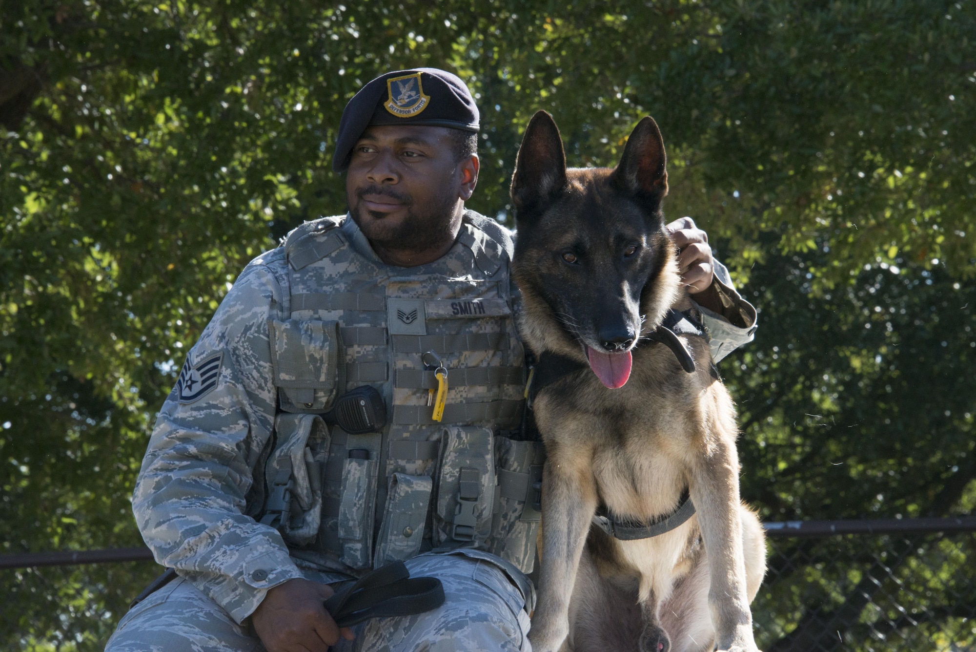 MWD Rocky leans toward his handler, Staff Sgt. Terrance Smith, when asked if he is ready to go to a new home at Maxwell Air Force Base, Oct. 6, 2016. Rocky is set to retire from military service at the end of October, and will join his work partner on their home couch. (U.S. Air Force photo by Senior Airman William Blankenship)