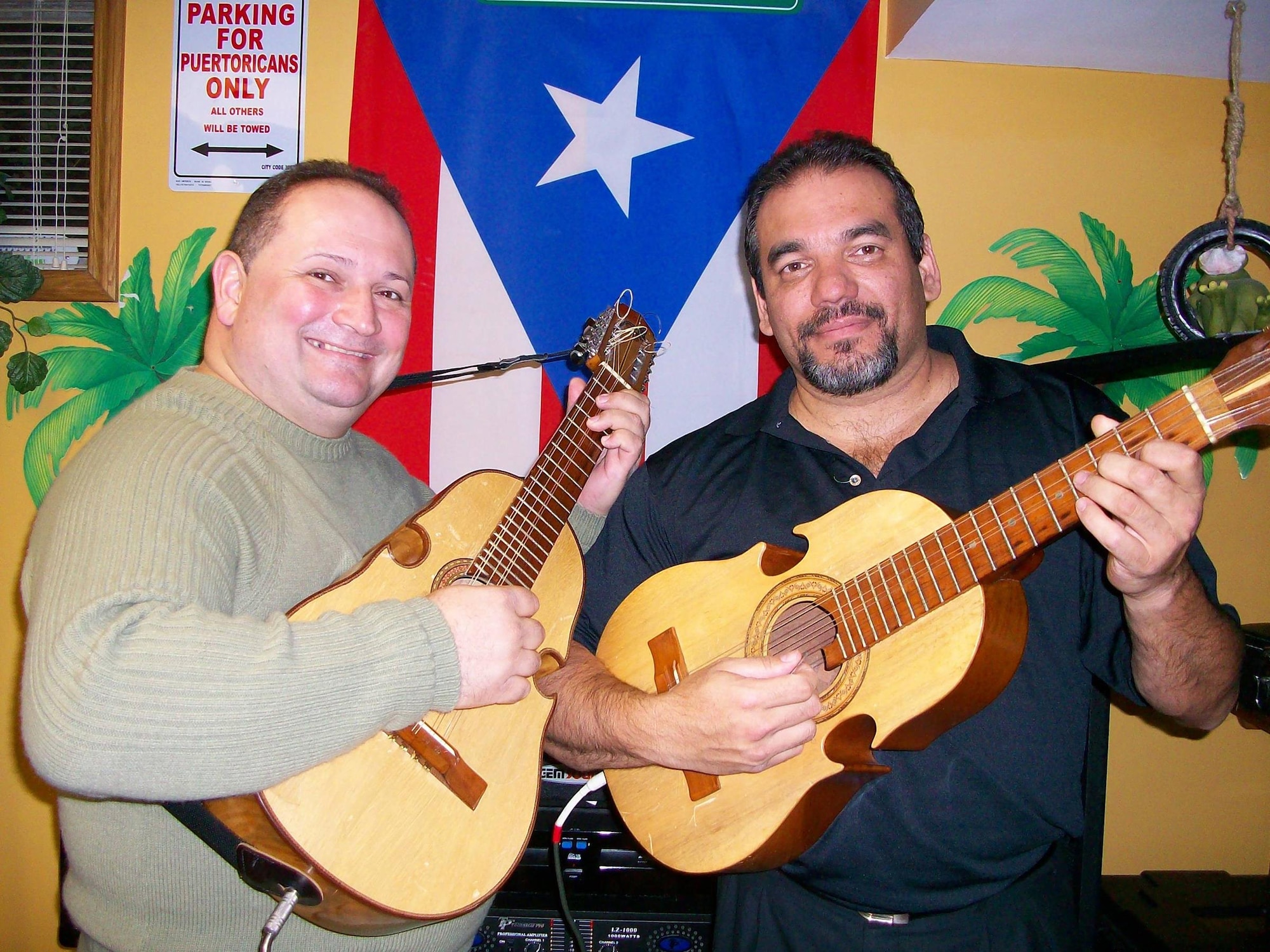 Lt. Col Herminio J. Lugo (right) is shown with Edwin Colon Zayas, a highly accomplished Puerto Rican "cuatrista" or Cuatro player, visiting Dayton, Ohio, Oct. 3, 2016. Lugo plays the Cuatro, the national instrument of Puerto Rico, for a local band. He performs in many different festivals representing the Hispanic culture throughout the year. (Courtesy photo)