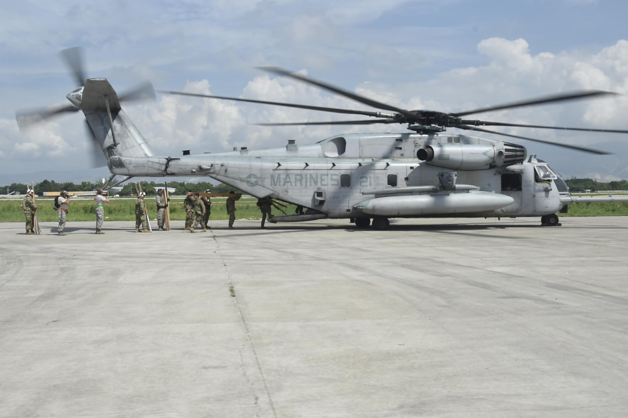 Airmen from the 621st Contingency Response Wing work with Marines from the Special Purpose Marine Air-Ground Task Force-South Command at Port-au-Prince, Haiti, October 10th, 2016.The CRW provides assistance by facilitating the flow of aid and cargo to those in need. (U.S. Air Force photo by Staff Sgt. Robert Waggoner/released)
