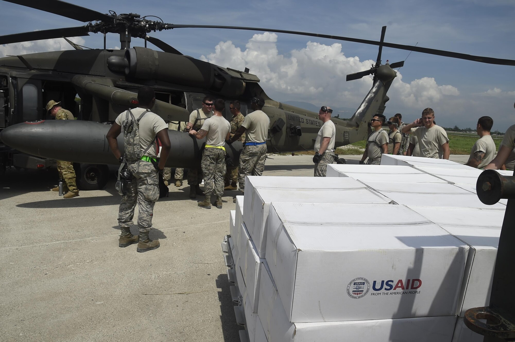 Airmen from the 621st Contingency Response Wing work with Marines from the Special Purpose Marine Air-Ground Task Force-South Command at Port-au-Prince, Haiti, October 10th, 2016.The CRW provides assistance by facilitating the flow of aid and cargo to those in need. (U.S. Air Force photo by Staff Sgt. Robert Waggoner/released)