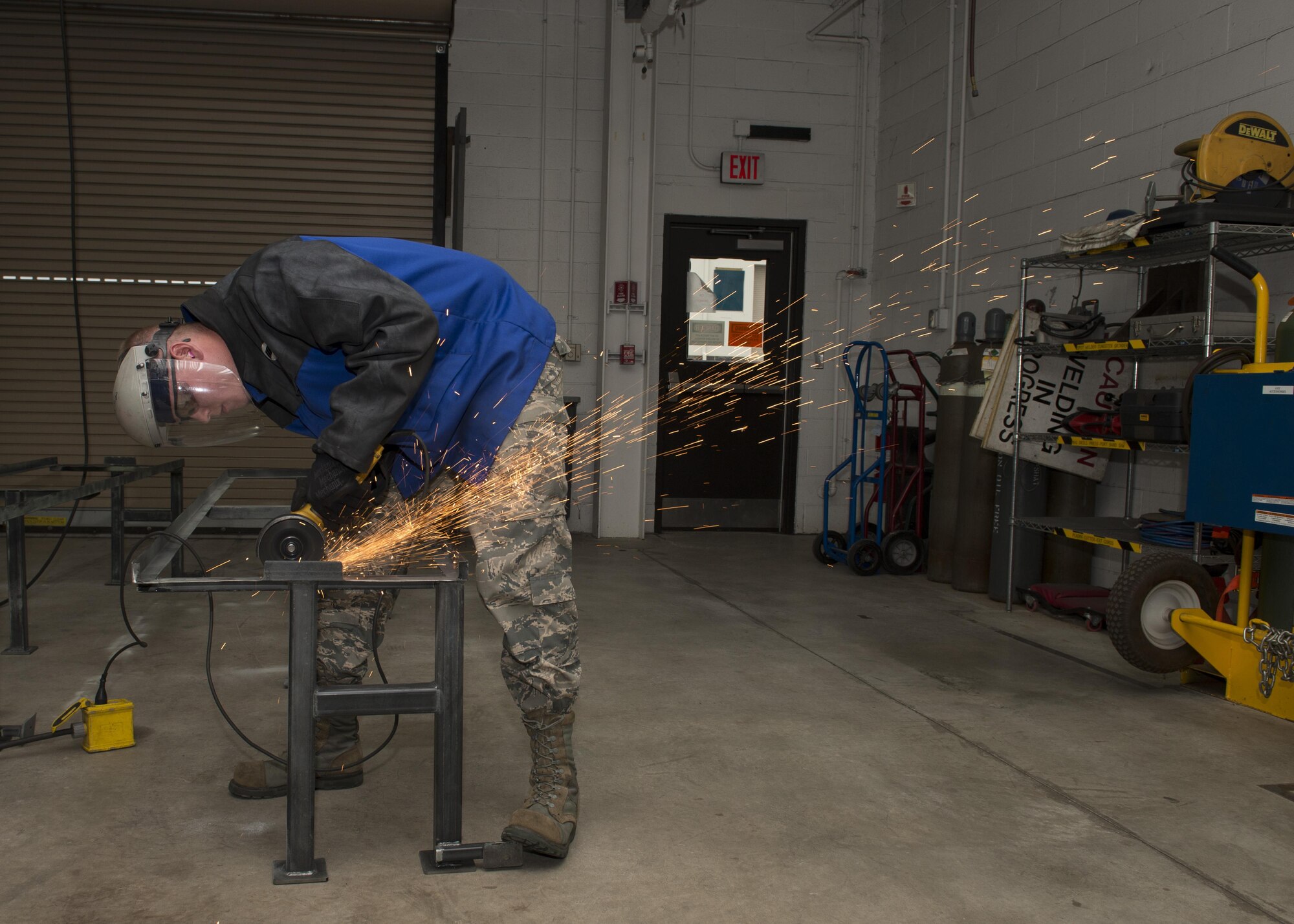 Senior Airman Cory Swan, 512th Maintenance Squadron metals technician, uses an angle grinder to remove a piece of metal from a metal frame Sept. 19, 2016, at Dover Air Force Base, Del. The Aircraft Metals Technology Shop’s primary mission is to support the C-5M Super Galaxy and C-17A Globemaster III airframes and secondarily assists the base’s other support equipment. (U.S. Air Force photo by Senior Airman Zachary Cacicia)