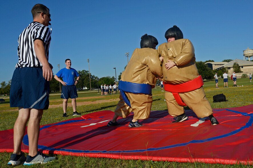 Team Shaw Airmen wrestle while wearing inflatable sumo-suits during the 20th Operations Group Olympics at Shaw Air Force Base, S.C., Sept. 30, 2016. The OG Olympics provided Airmen an opportunity to interact with each other, boosting morale. (U.S. Air Force photo by Airman BrieAnna Stillman) 