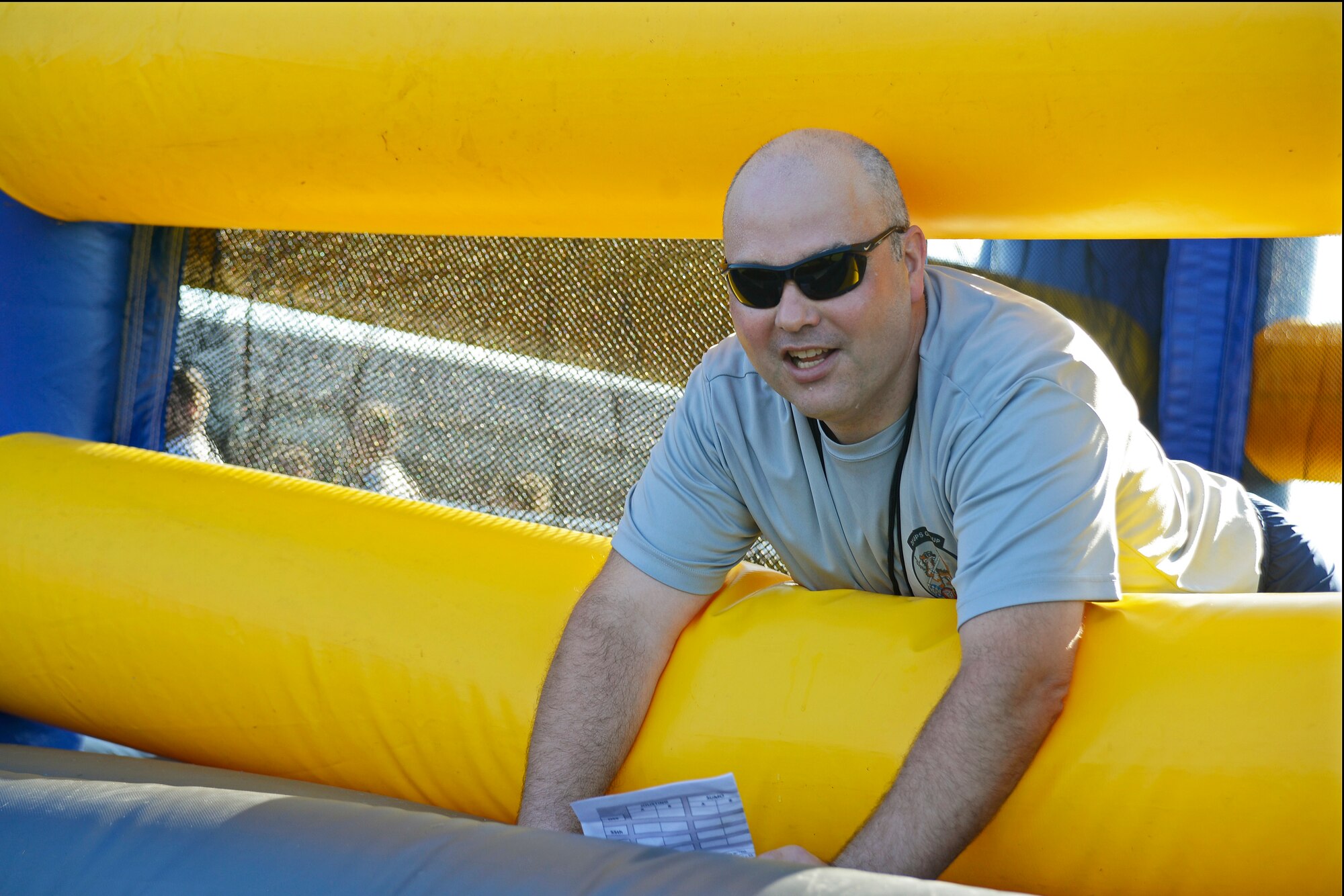 U.S. Air Force Chief Master Sgt. Thomas Boslet, 20th Operations Group superintendent, explains the rules of inflatable boxing at Shaw Air Force Base, S.C., Sept. 30, 2016. Boslet was a referee during the 20th OG Olympics and encouraged people to compete in events and meet wingmen from opposing squadrons. (U.S. Air Force photo by Airman BrieAnna Stillman) 