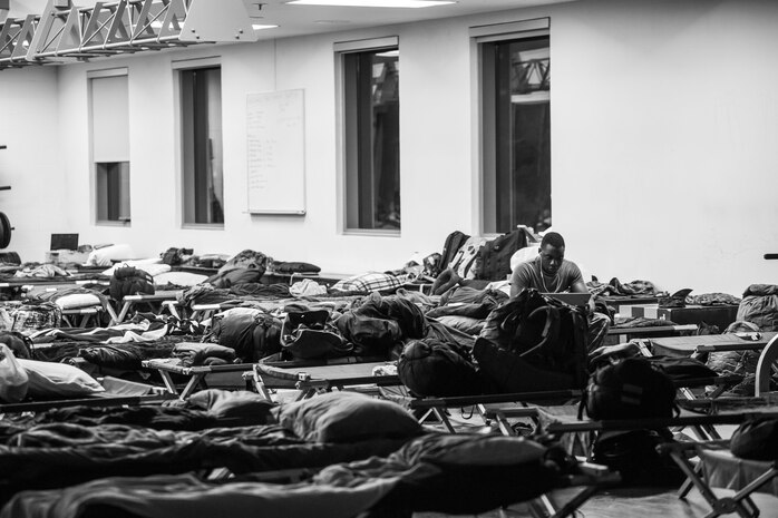 Cpl. Jimmy Vertus uses his computer to stay in touch with family aboard Marine Corps Air Station Beaufort Oct. 7. As Hurricane Matthew passes through Florida,  MCAS Beaufor prepares for recovery efforts if needed. Vertus is a noncommissioned officer with Combat Camera, Headquarters and Headquarters Squadron. 