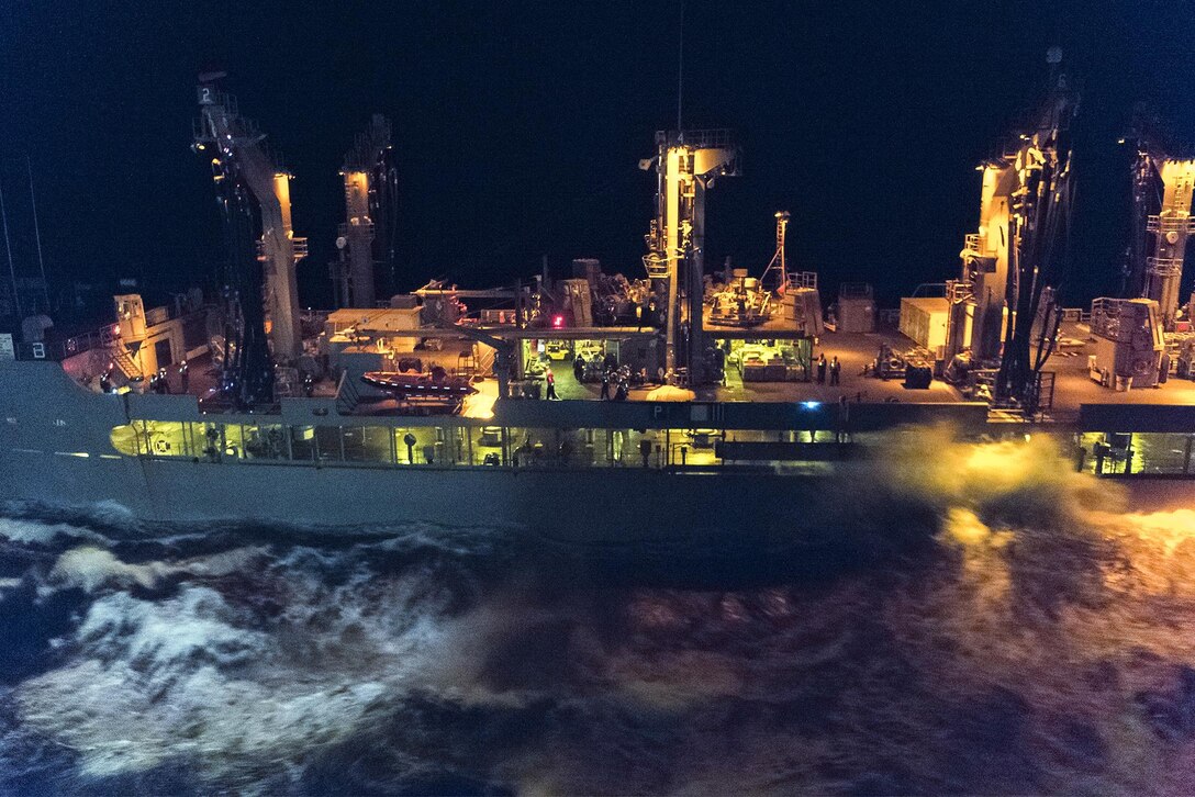 The amphibious transport dock ship USS Mesa Verde conducts a replenishment to receive food and medical supplies from the fleet replenishment oiler USNS Patuxent in the Atlantic Ocean, Oct. 6, 2016. The Verde is underway to support humanitarian assistance and disaster relief efforts in Haiti in response to Hurricane Matthew. Navy photo by Petty Officer 3rd Class Joshua M. Tolbert