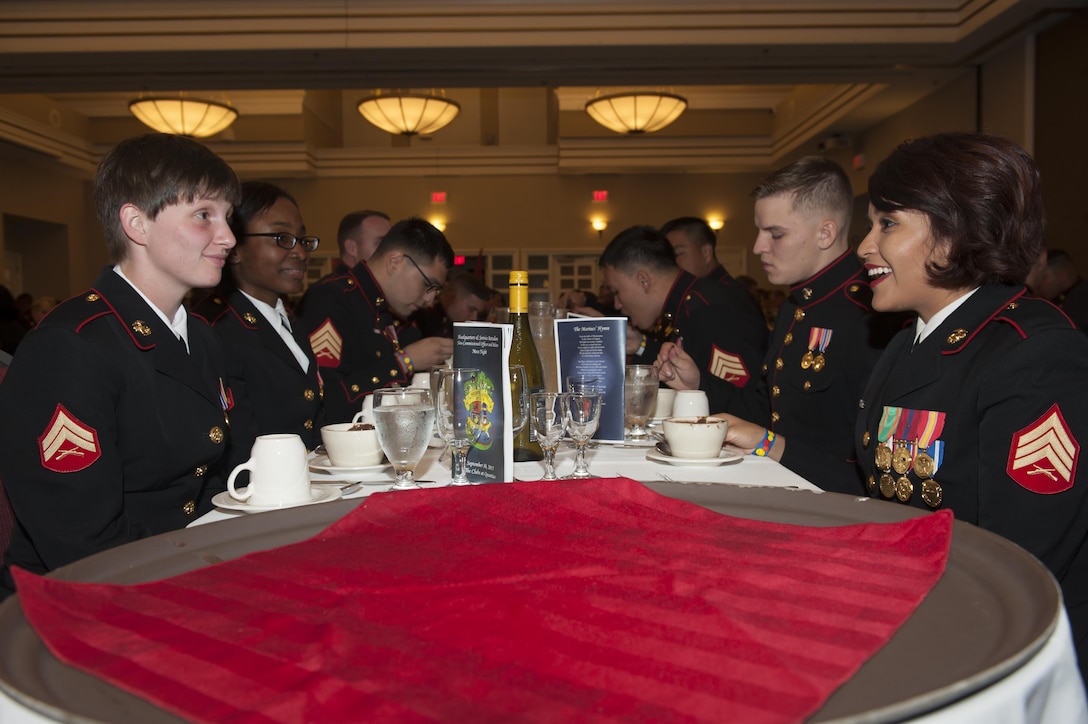 U.S. Marines share conversation over dinner during Headquarters and Service Battalion Mess Night, at The Clubs at Quantico, Marine Corps Base Quantico, Va., Sept. 30, 2016. The Marine Corps mess night, a time honored tradition since the 1950s, builds Esprit de Corps with the Marines, providing camaraderie, food and entertainment, and toasts honoring the sacrifices of past and present Marines who have served in the Corps. (Photo by Lance Cpl. Yasmin D. Perez)