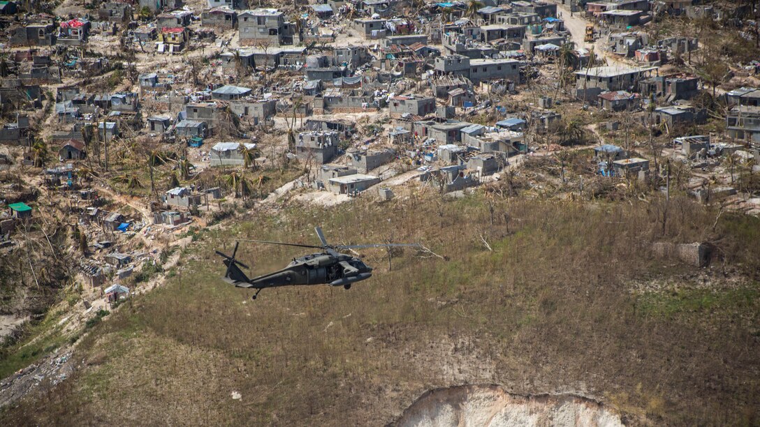 U.S. Army UH-60 Black Hawk helicopter pilots with Company A, 1st Battalion, 228th Aviation Regiment, deployed in support of Joint Task Force Matthew, fly toward Jeremie, Haiti, Oct. 10, 2016. JTF Matthew, a U.S. Southern Command-directed team, is comprised of Marines with Special Purpose Marine Air-Ground Task Force – Southern Command and soldiers from Joint Task Force-Bravo’s 1st Battalion, 228th Aviation Regiment, and is deployed to Port-au-Prince at the request of the Government of Haiti on a mission to provide humanitarian and disaster relief assistance in the aftermath of Hurricane Matthew. 