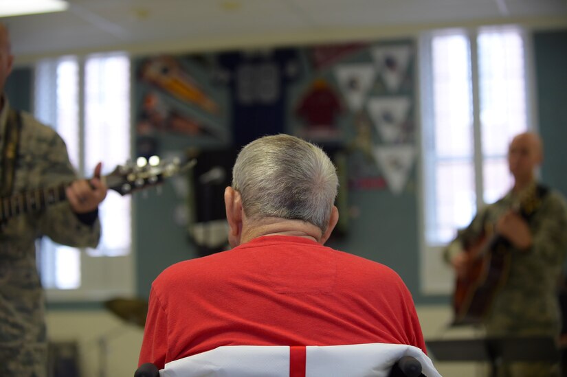 A patient with the Salem Veteran Affairs Medical Center listens to an interactive performance by the Blue Aces from the U.S. Air Force Heritage of America Band in Salem, Va., Sept. 26, 2016. In addition to one-on-one interactions with a few veterans, the band members performed for inpatients and members of the oncology section. (U.S. Air Force photo by Senior Airman Kimberly Nagle)